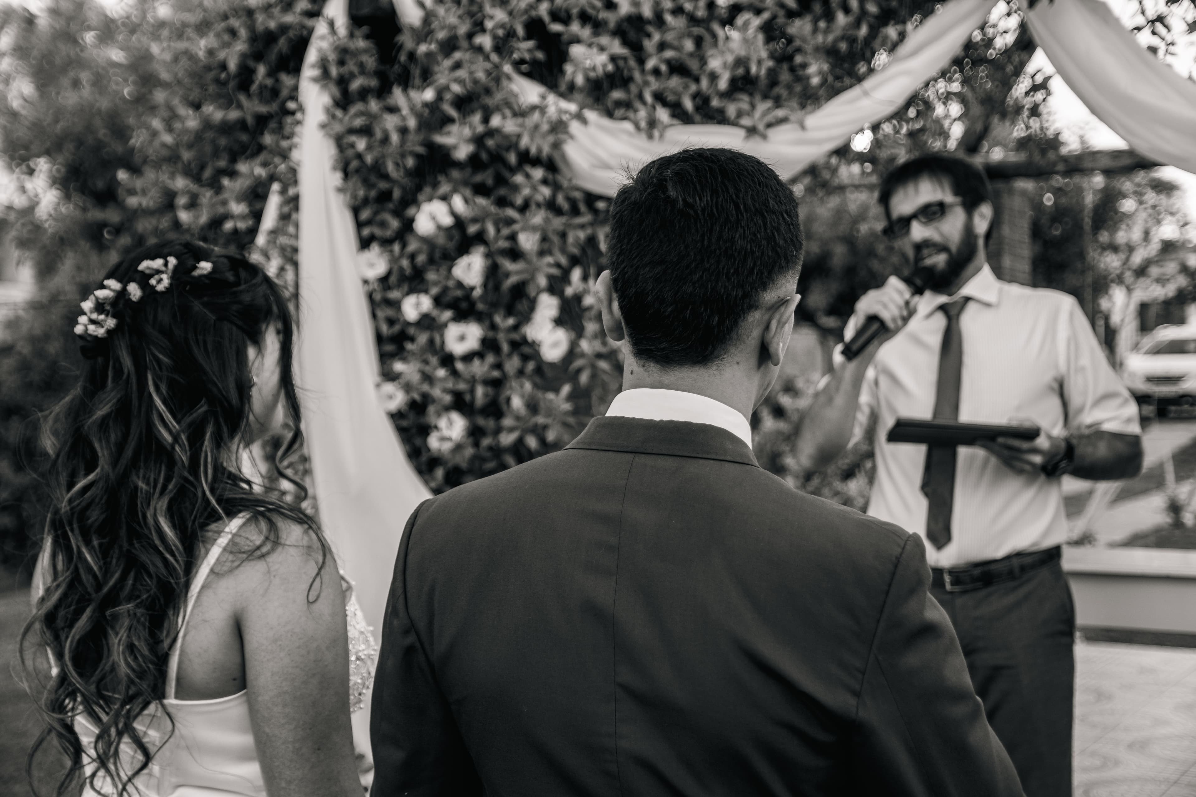 Couple exchanging vows during an outdoor ceremony